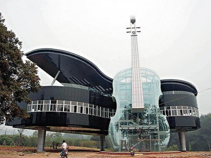 A unique house in the form of a piano with a violin