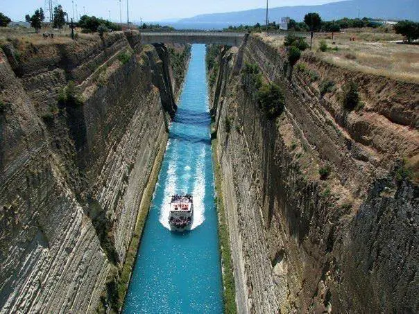 The Corinthian Canal is a man-made waterway connecting the two seas: the Aegean and the Ionian.
