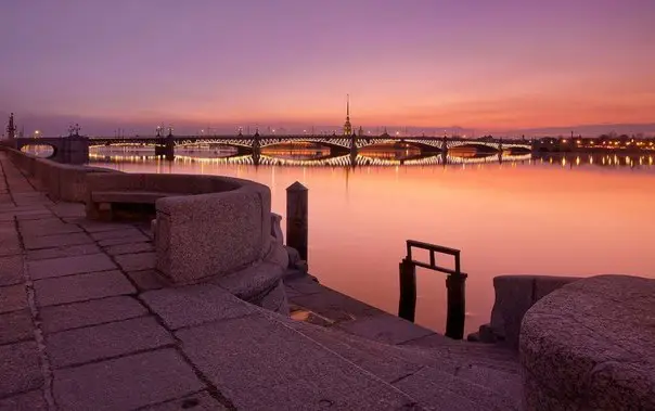 The Neva embankment during white nights in St. Petersburg, Russia.