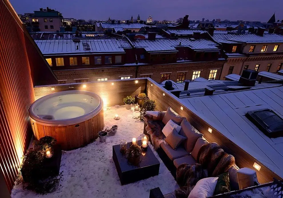 Hot bath on the winter roof of a house in Gothenburg, Sweden
