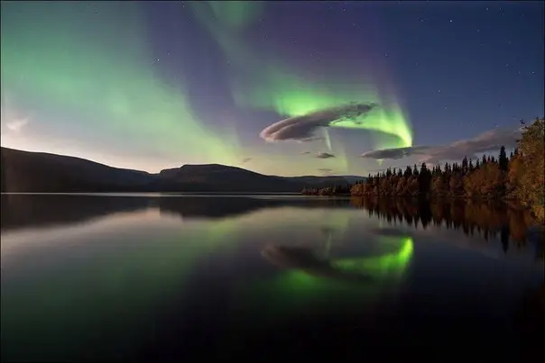Northern Lights with reflection in the Seydozers, Kola Peninsula, Russia