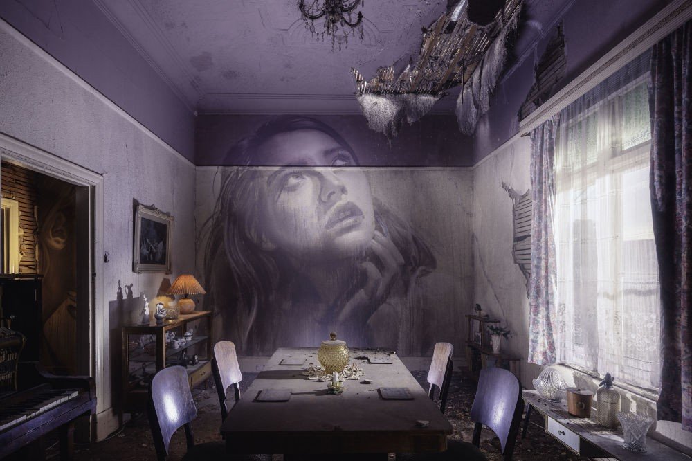 An artist from Melbourne transforms abandoned buildings by painting portraits of women on their walls