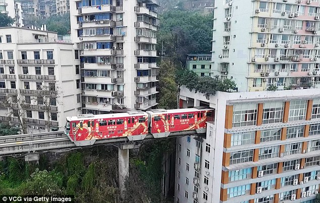 In China, the train passes directly through the residential building