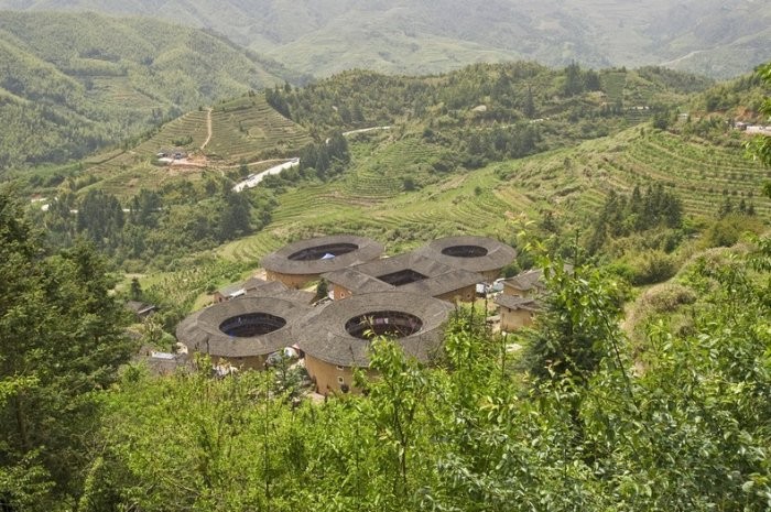 The ancient castle of tulou in Fujian Province. These unique buildings, called tulow, began to appear during the Tang Dynasty, in the 10th century, when Hakka people were forced to migrate to southern China and defend themselves from the local population.</p>