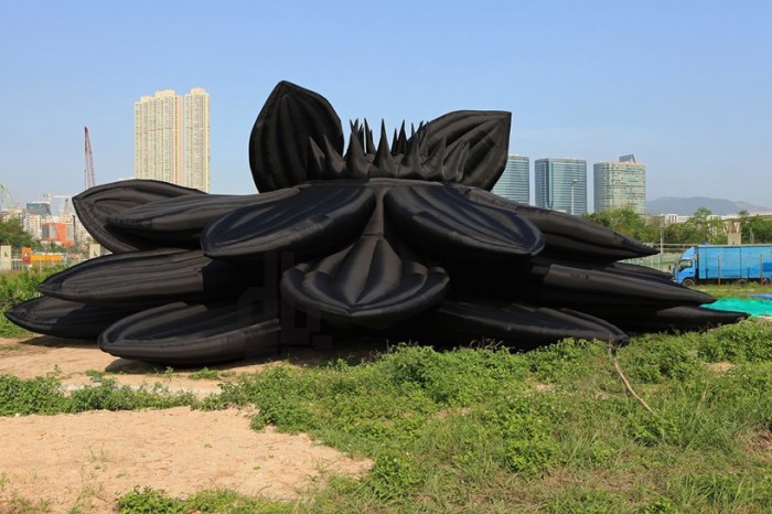 Inflatable heaps, pig and locust in Hong Kong