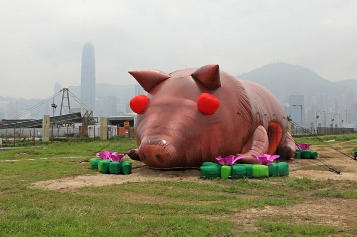 Inflatable heaps, pig and locust in Hong Kong
