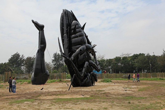 Inflatable heaps, pig and locust in Hong Kong