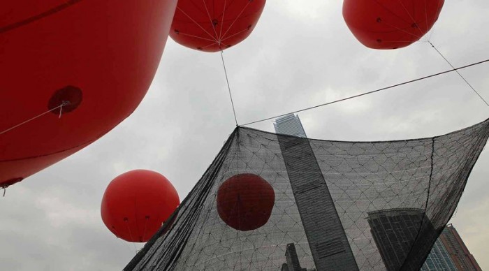 Inflatable heaps, pig and locust in Hong Kong