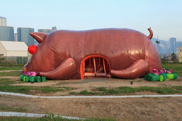Inflatable heaps, pig and locust in Hong Kong