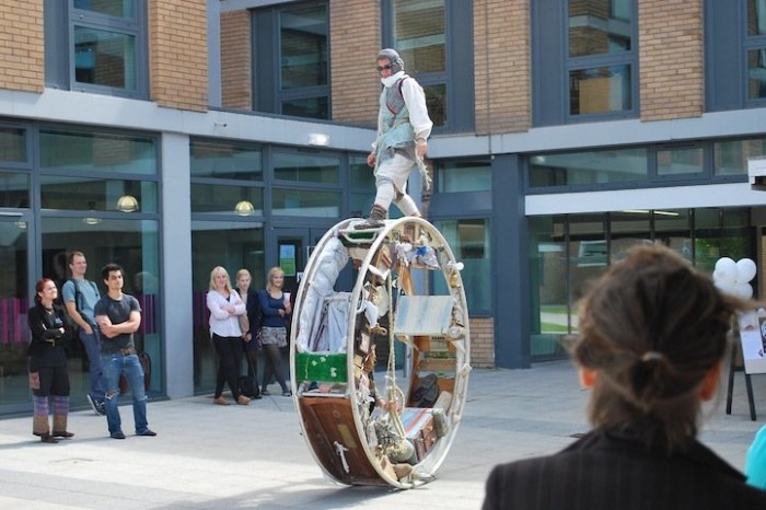 Traveling acrobats in a circular house on wheels