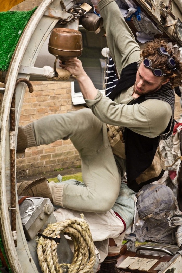 Traveling acrobats in a circular house on wheels