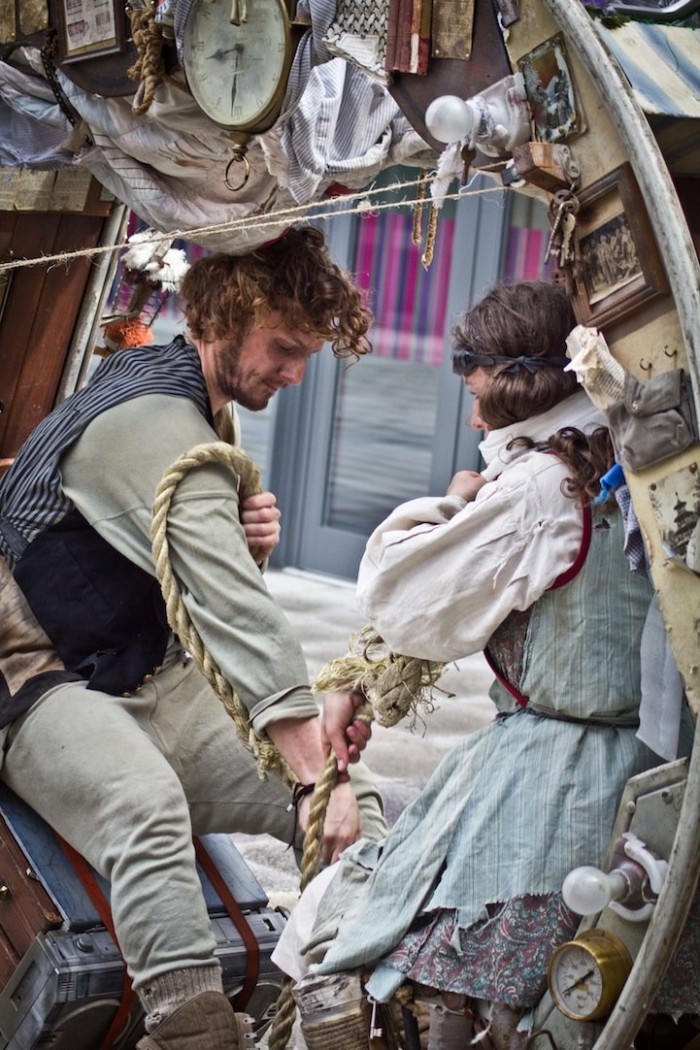 Traveling acrobats in a circular house on wheels