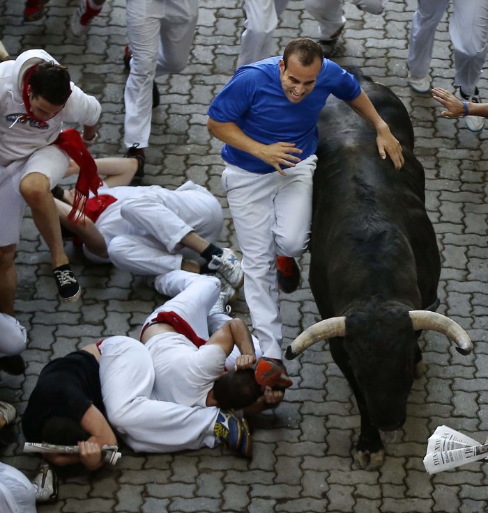The Festival of San Fermin 2013 and the flight from the bulls