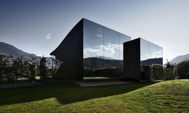 Mirror houses in the Dolomites Alps