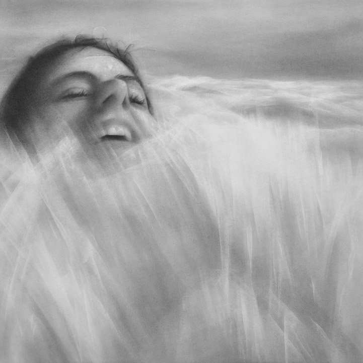 Photorealistic portraits of graphite dust