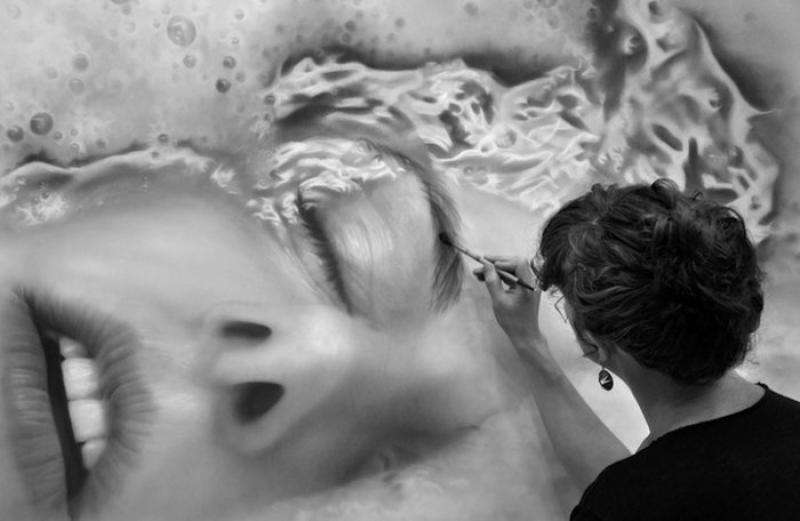 Photorealistic portraits of graphite dust