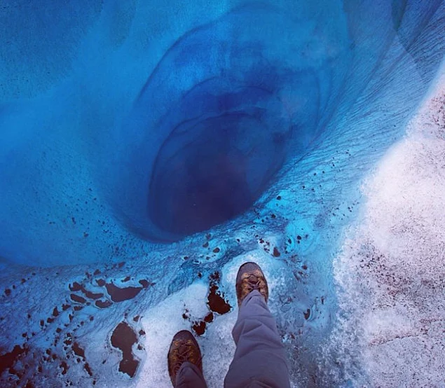 305-meter pit covered thin layer of ice