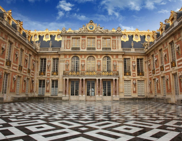 The marble courtyard of the Palace of Versailles, where the hunting lodge used to be.