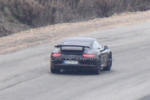 Photospies allowed us to take a close look at the new Porsche 911 GT3 (991). Although the photos were taken from a distance, it is still possible to see that there is a fixed rear spoiler, two exhaust pipes installed in the center of the vehicle body, and other new features,</p>\n  "home_text": "<p>the front bumper now has a lower profile.</p> - 5