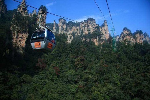 攀登华山的过程堪称是一次独特的 adventure journey.登上山顶, one can enjoy the magnificent views of the surrounding mountains and landscapes. From the summit, one can even see as far as the Yellow River. The cable car system on Mount Hua is an excellent example of advanced transportation technology. This modern facility not only provides convenient transportation for tourists, but also plays a crucial role in environmental protection and conservation of natural resources. The cable car system on Mount H华 consists of - 5