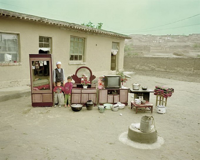 The project by the Chinese photographer Hong Qingjun is called “Family Materials”. - 8