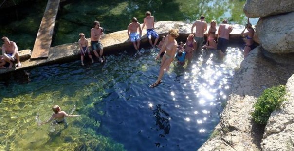 Jacob's Well in Texas is a natural cave that is over 100 meters deep and has a diameter of approximately 4 meters.
