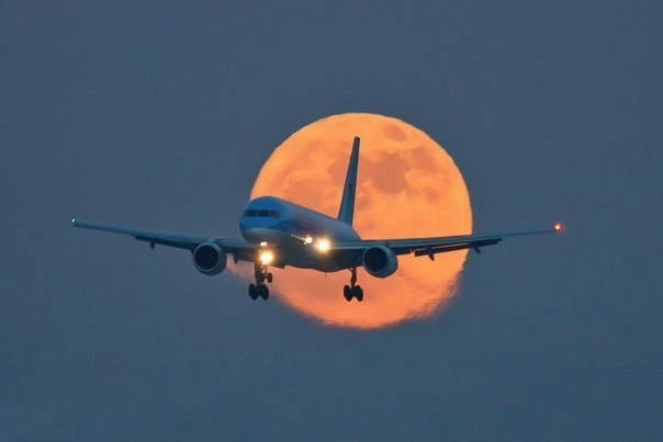 Airplane in the background of the moon, Austria