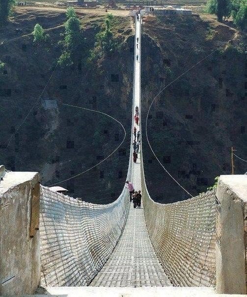 The bridge in Nepal. Not for the faint of heart!