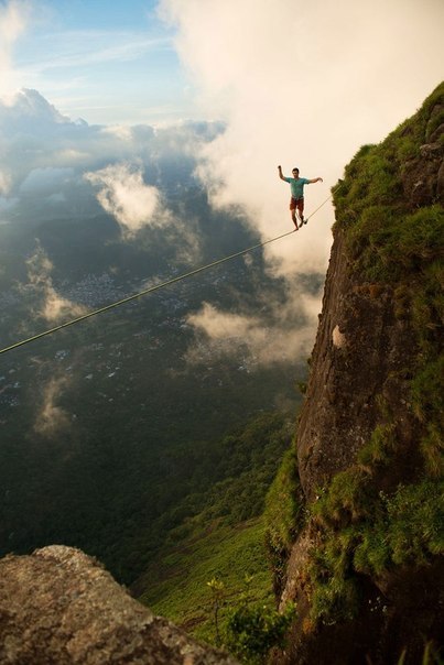 Slacklin over Rio de Janeiro. Bray Brian Mosbo made a walk along the rope at an altitude of 850 meters near Rio de Janeiro his assistants made a series of spectacular shots