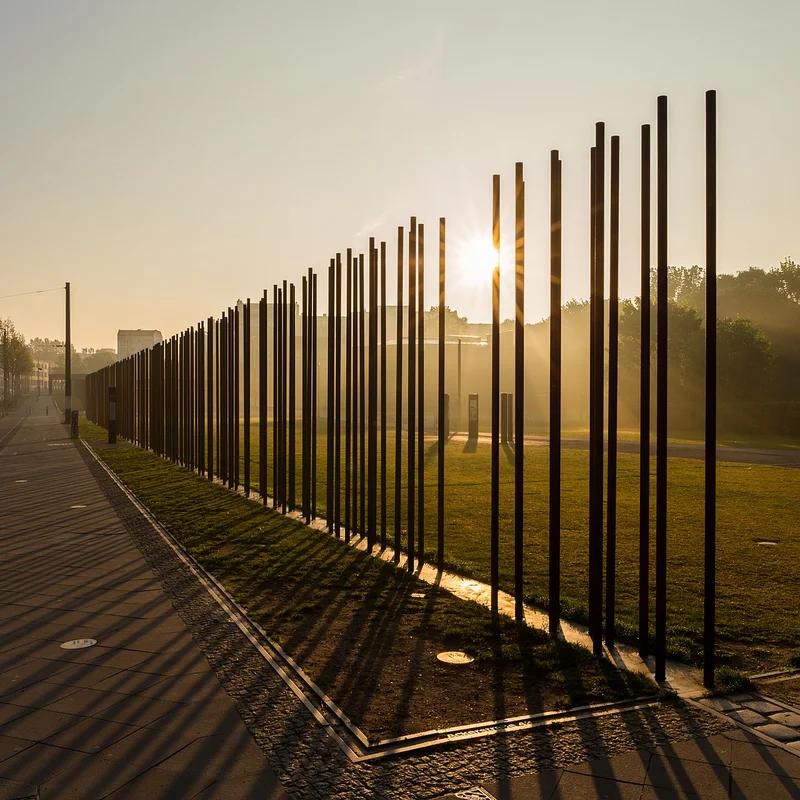 The last remaining fragment of the Berlin Wall on Bernauer Strasse, with a memorial in its vicinity