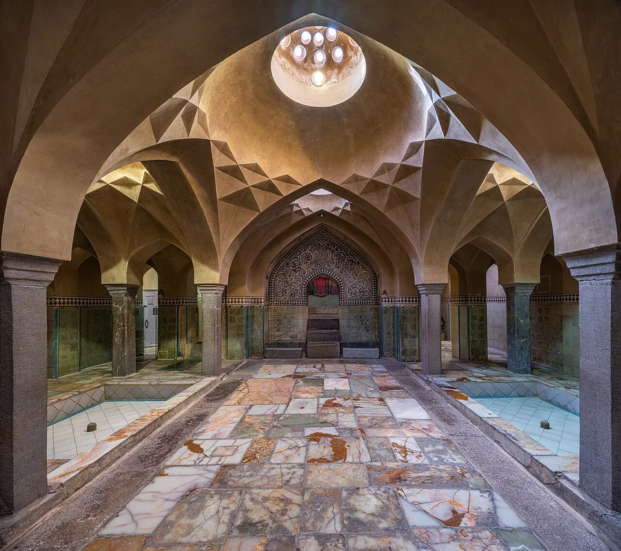 Interior of a traditional hammam with hot rooms and marble seating